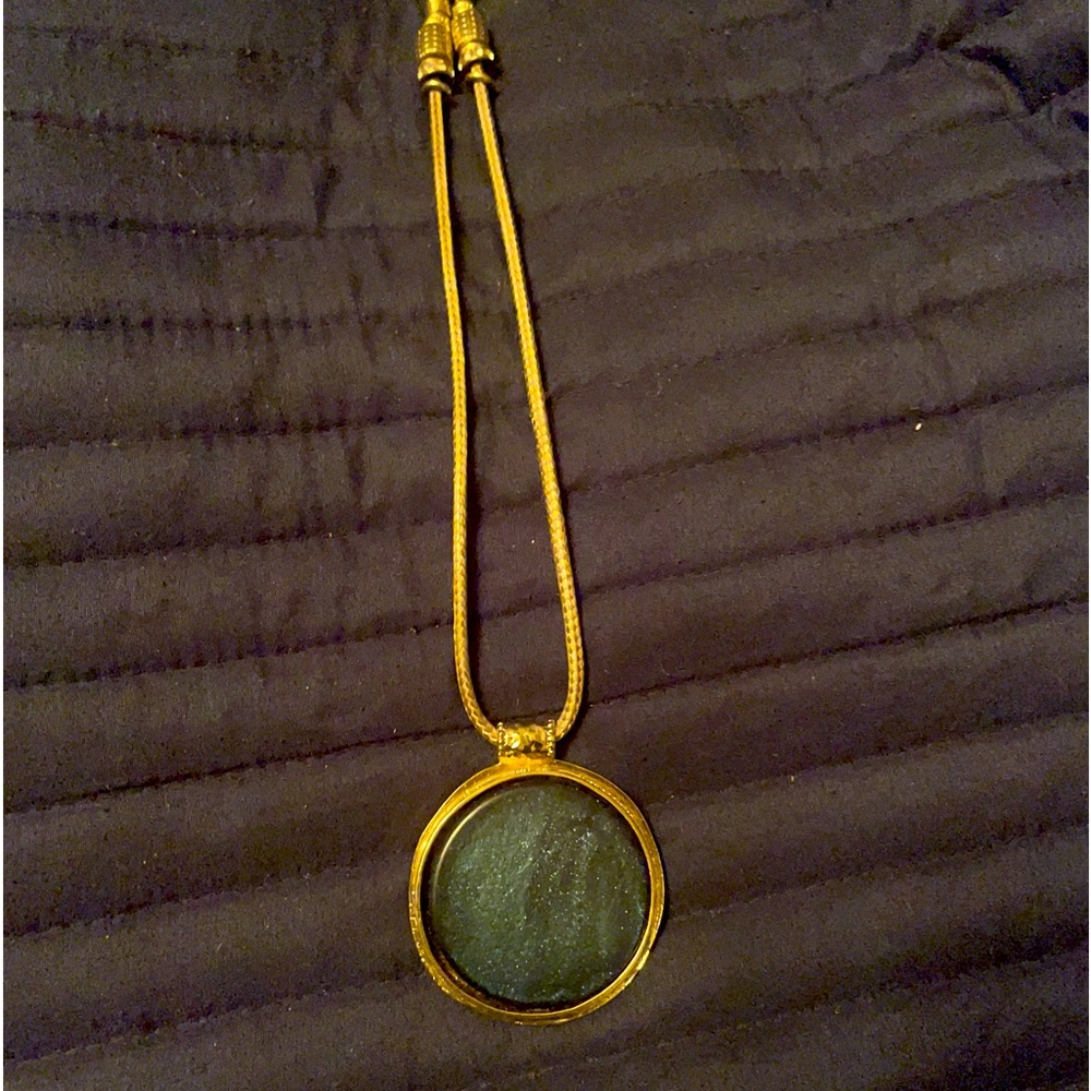Chico’s gold necklace with green medallion